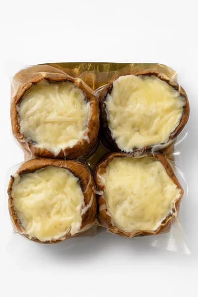 Шампиньоны фаршированные под сырной шапкой, кг